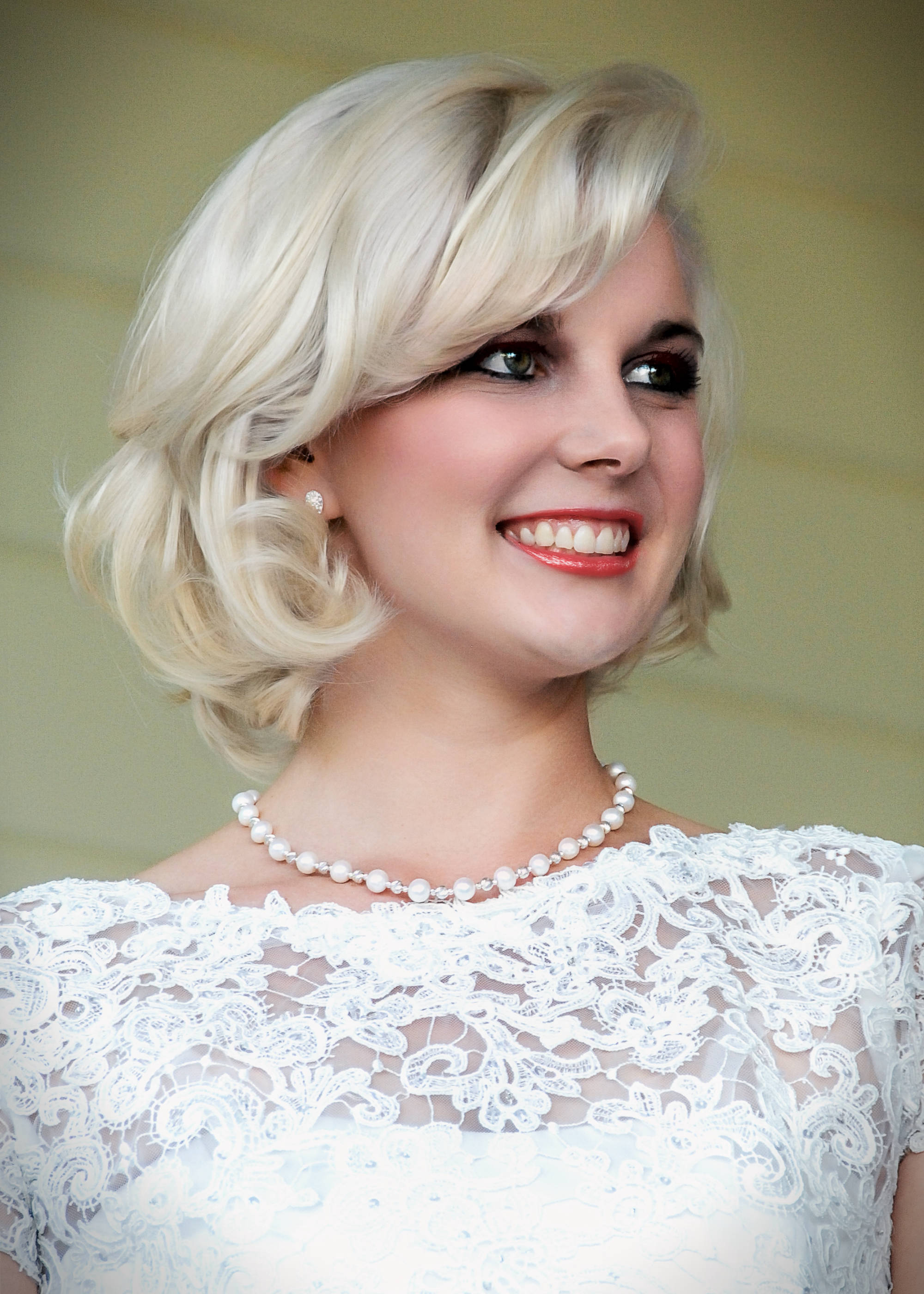 Bride in white dress and pearls